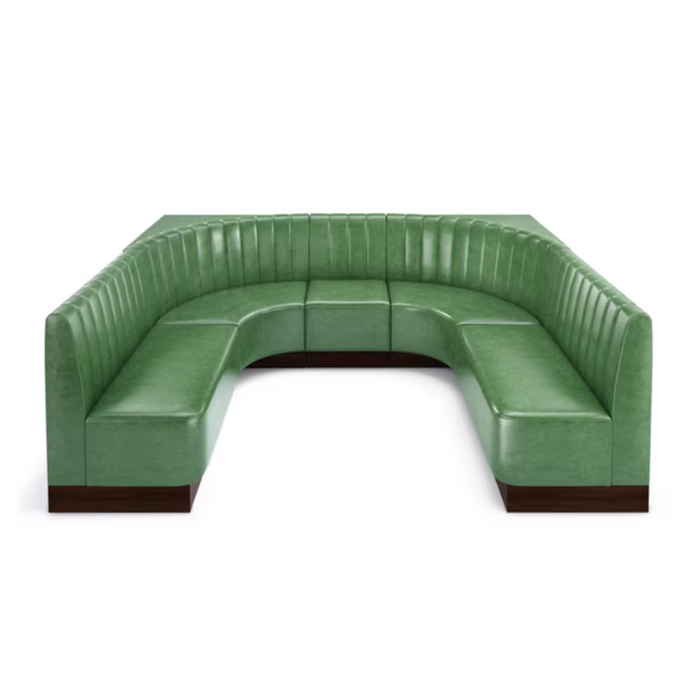 Green leather upholstered corner booth sofa with vertical channel backrest, ideal for restaurant or diner seating.