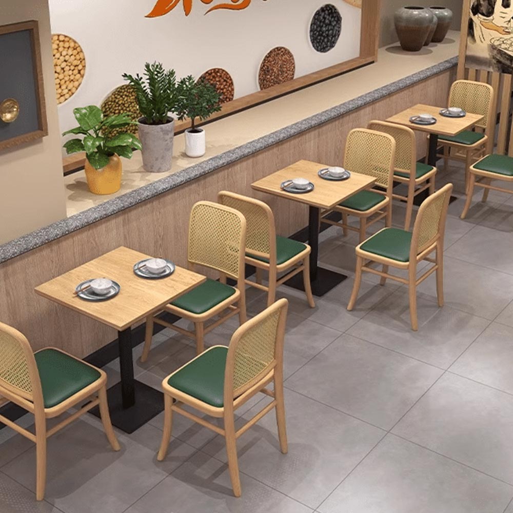 Modern dining space with green and wooden seating