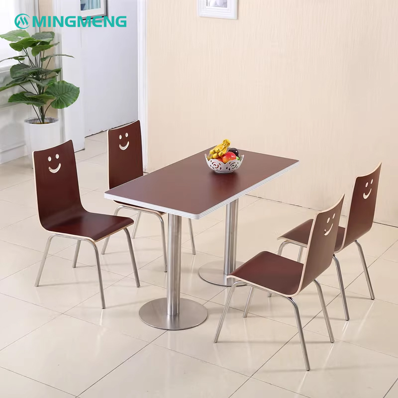 Four dark wood smile backrest chairs with silver metal legs around a matching dining table in a clean indoor setting