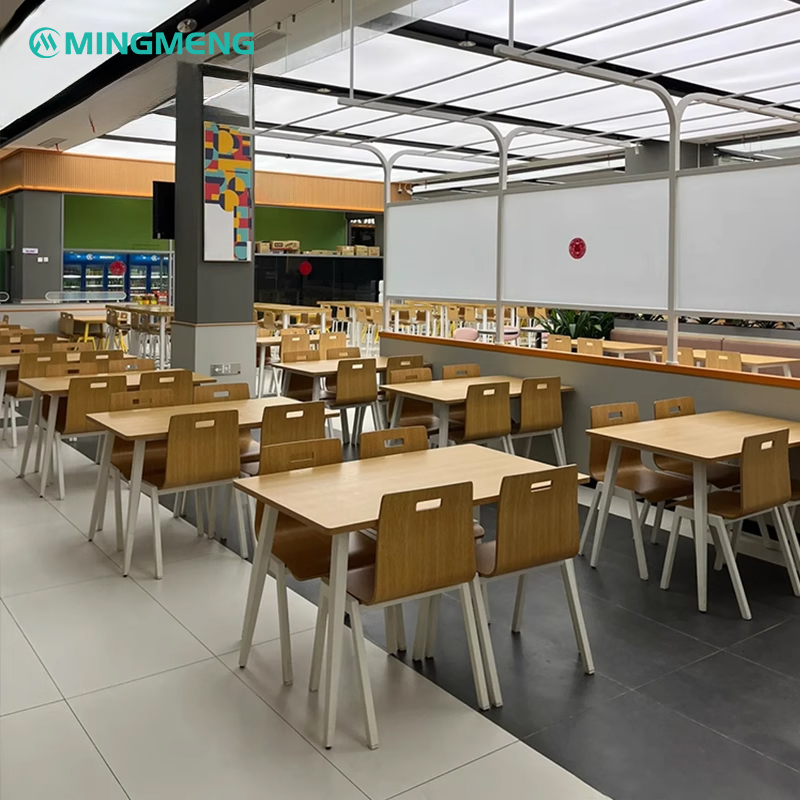 Stackable bentwood canteen chairs with stainless steel legs in a modern dining room