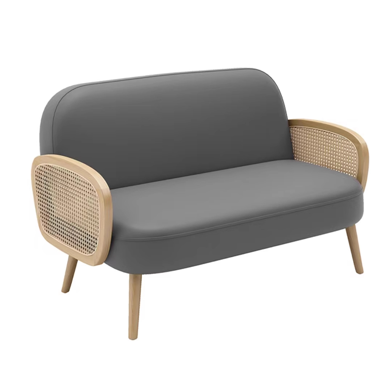 Cream-Colored Booth with Rattan Armrests4 Beige and gray two-tone restaurant furniture sofa with cane-back design and wooden legs.
