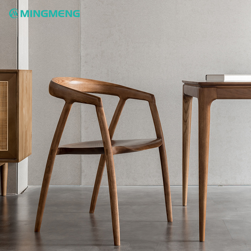 Dark wood Japanese solid wood dining chair next to matching table