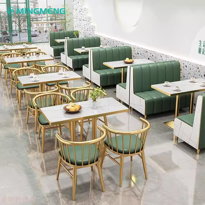 Elegant restaurant layout featuring rock slab tables and long green booth seating