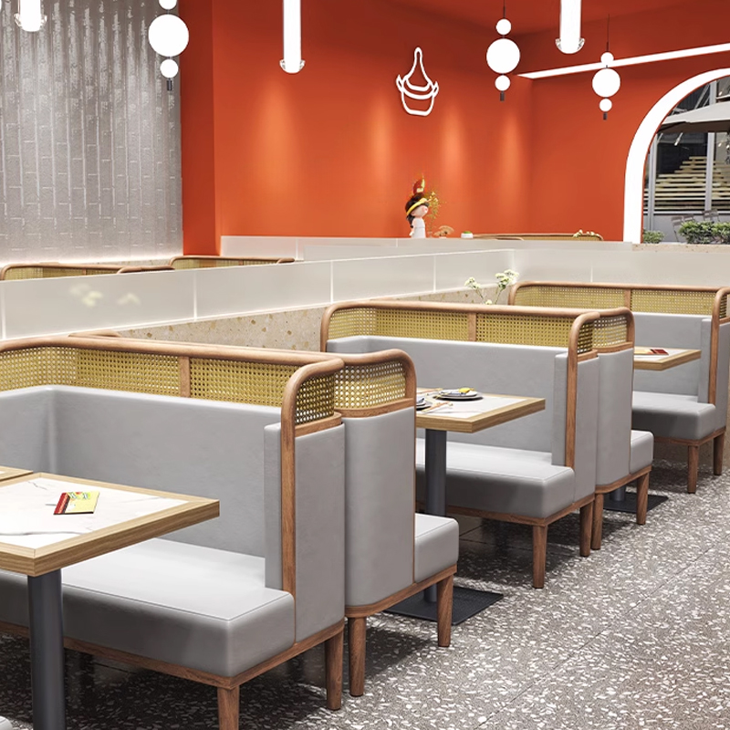 Vintage Rattan Backrest Leather Restaurant Booth1 Long row of grey booth seating with natural wood and rattan accents, modern restaurant interior.