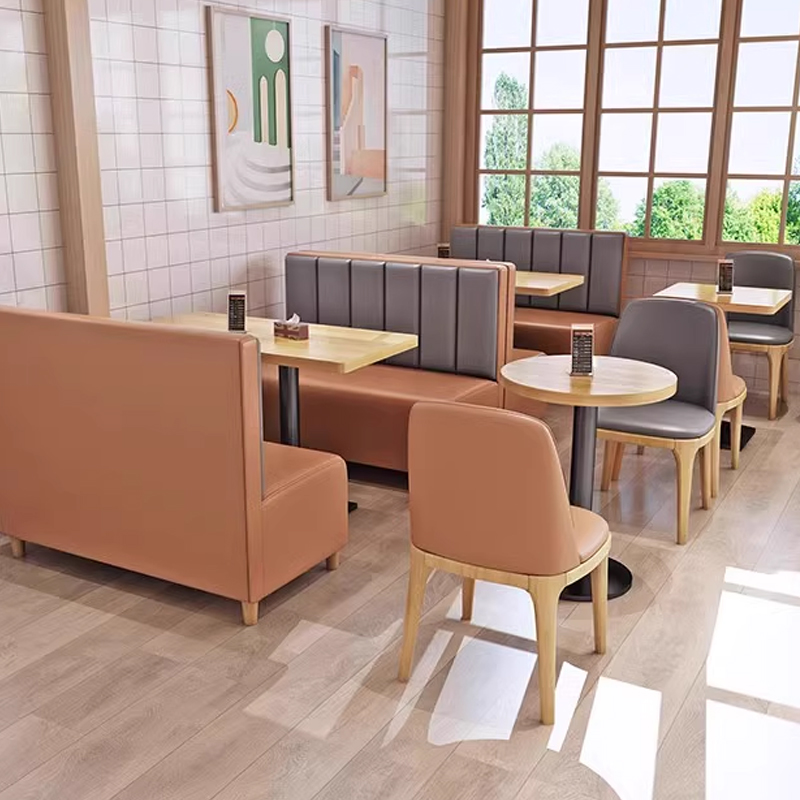 Two-Tone Dining Booth-Upholstered Bench With Back Light wood tables with brown and gray leather booths in a bright restaurant