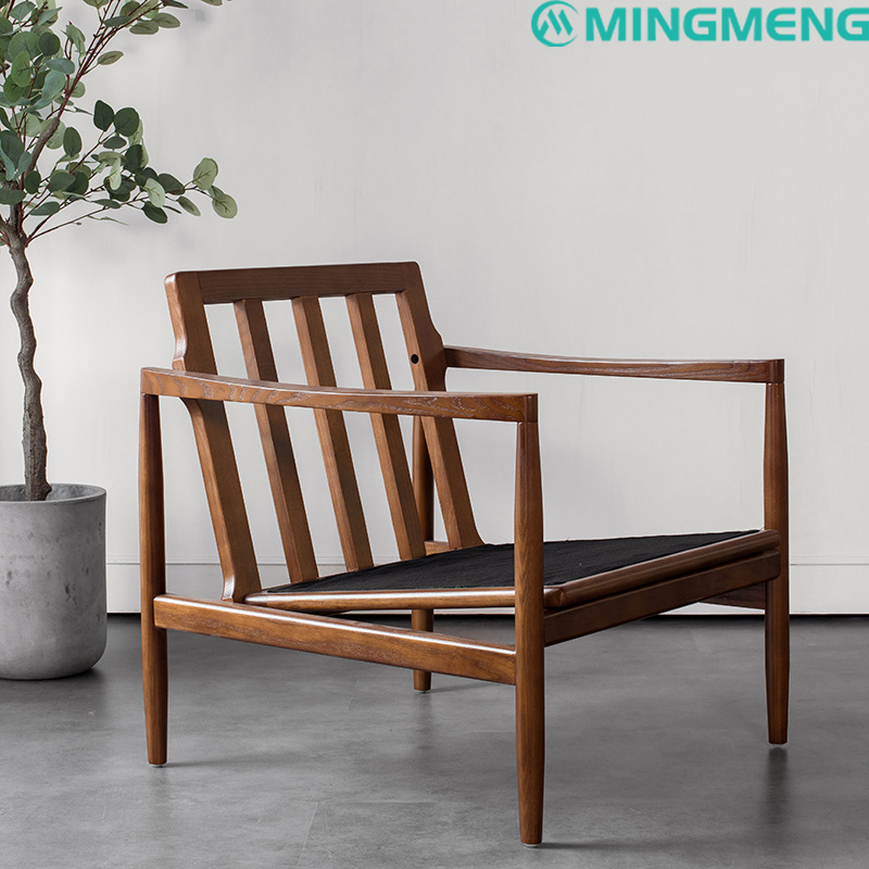 Solid wood lounge chair frame in walnut finish with open slatted back and armrests