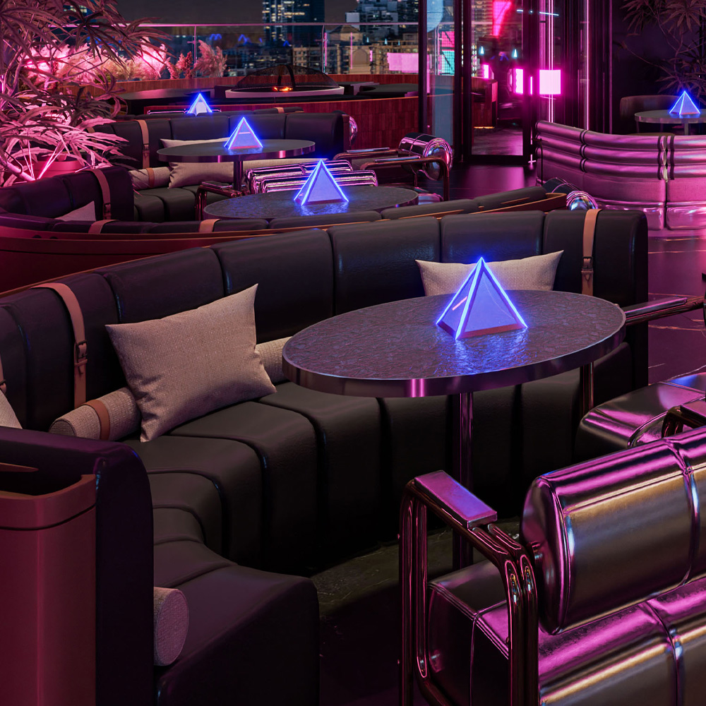 Luxurious lounge seating in a modern bar featuring neon-lit pyramid decor and plush pillows.