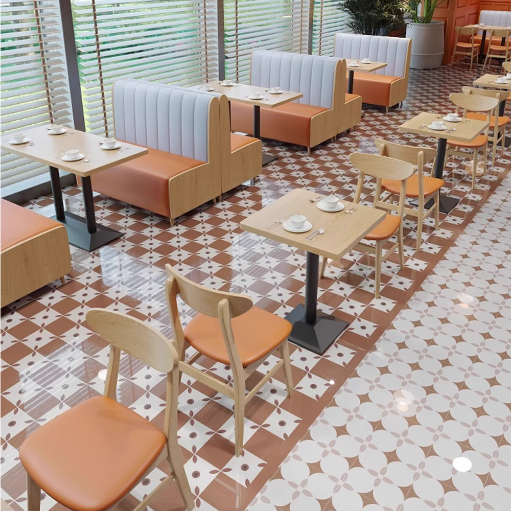 Modern restaurant interior with light wood booth seating and orange cushioned dining chairs