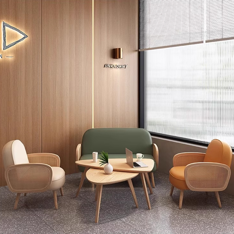 Cream-Colored Booth with Rattan Armrests2 Cozy modern restaurant booth seating with wooden tables, designed for a stylish dining experience.