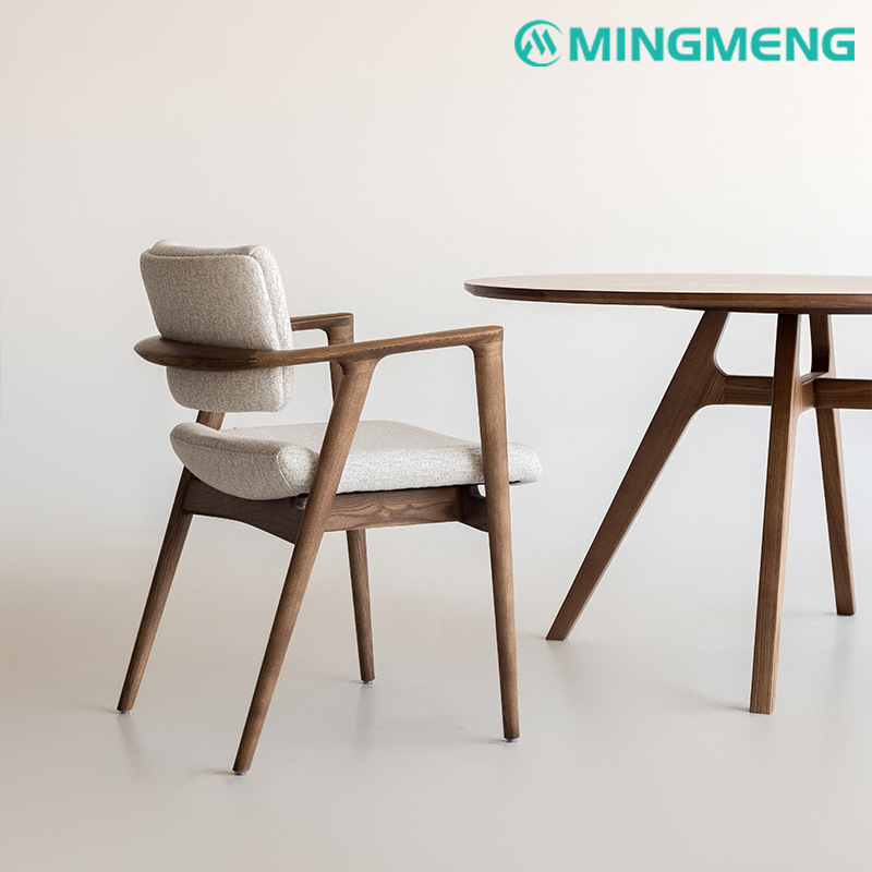 Minimalist upholstered dining chair with curved wood frame and armrests