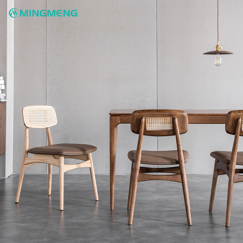 Dark wood Nordic dining chair with brown cushion and rattan backrest