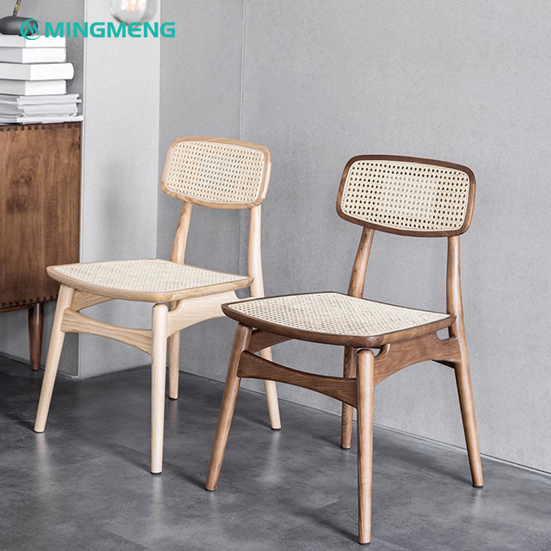 Side-by-side view of Nordic style solid wood rattan dining chairs in light wood and walnut finish, featuring woven rattan seats and backs.