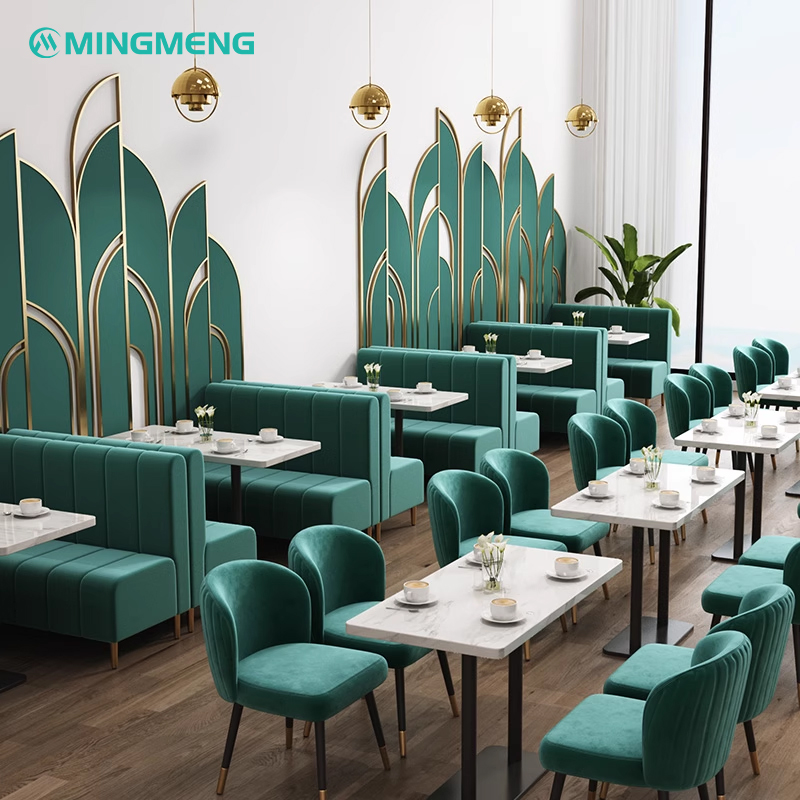 Multiple green booth seating arrangements in a modern restaurant interior