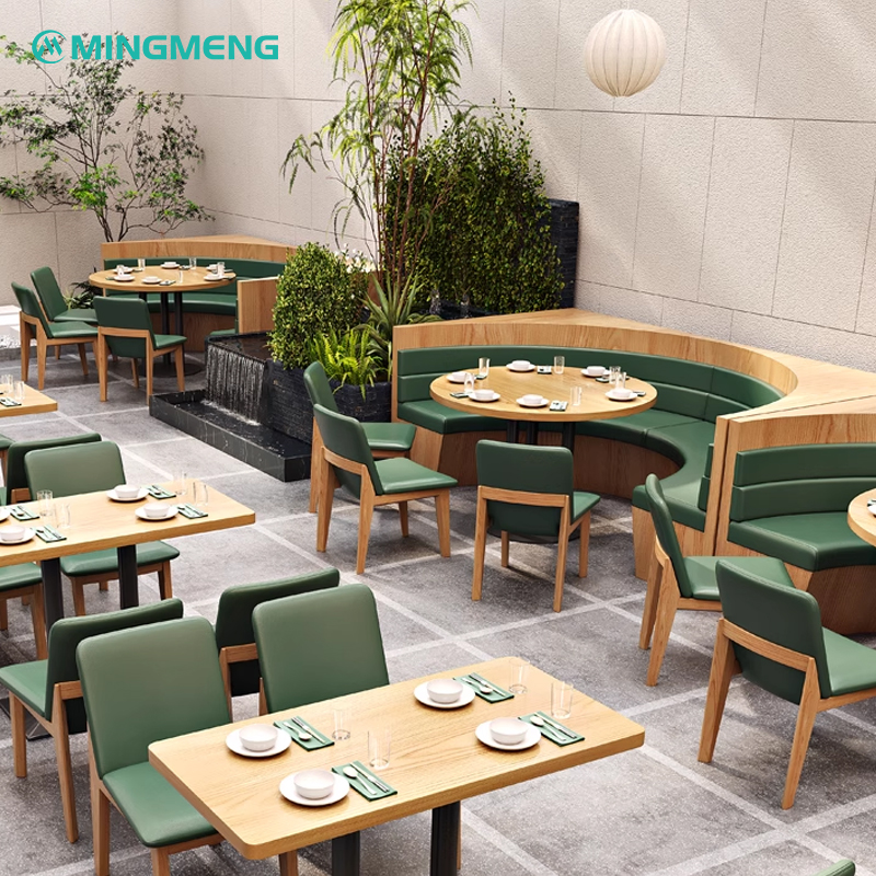 A curved restaurant booth with green seating and wooden accents, perfect for cozy dining areas in cafes and restaurants.