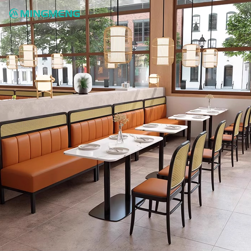 Cushioned seating in modern restaurant booth with wooden backrest