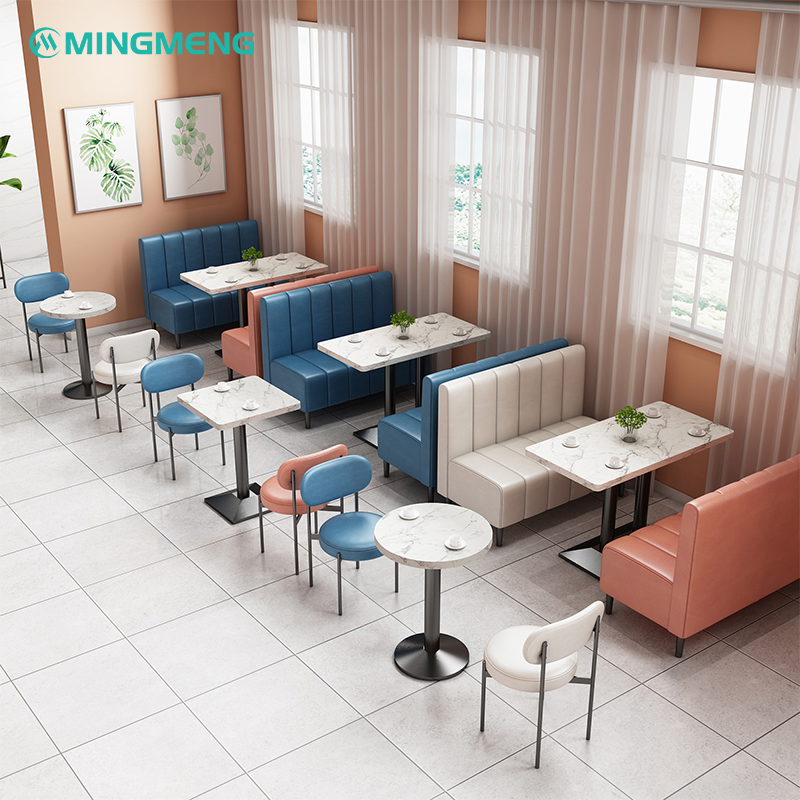 Cream and blue upholstered restaurant booth seating with elegant interior