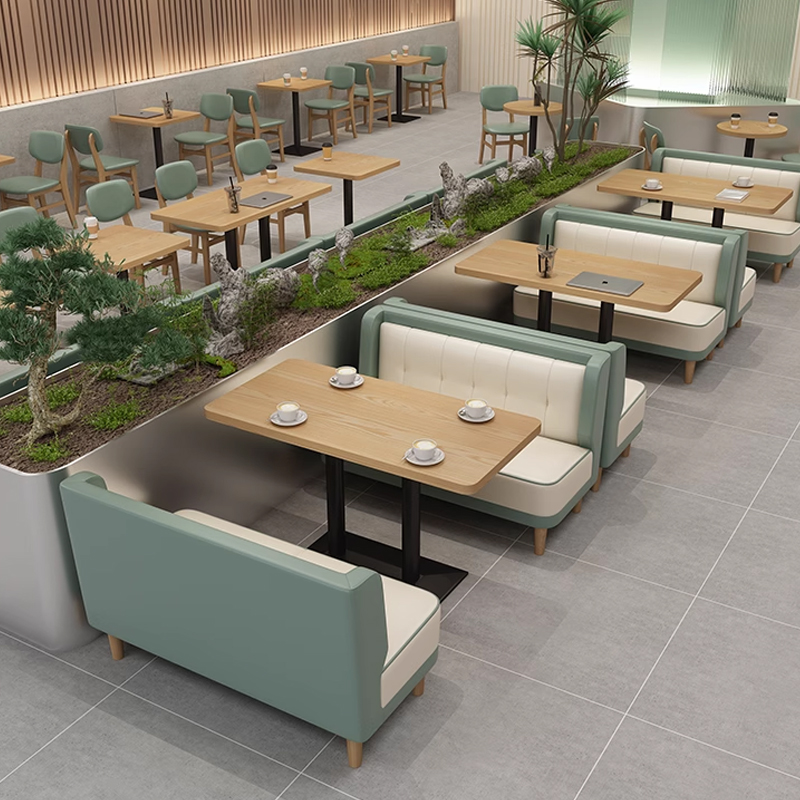 Two-Tone Casual Dining Booth for Western Restaurants Restaurant booth with a green cushion design, stylish wooden table setup
