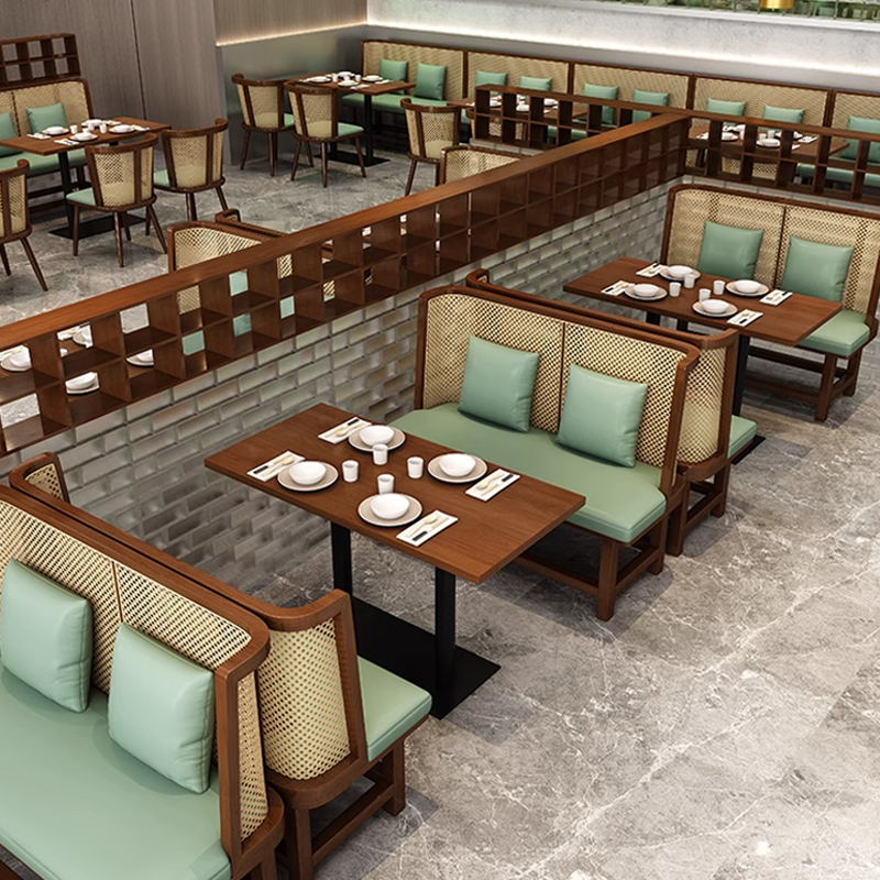 Cane Back Wooden Booth Seating1 Restaurant interior with modern seating and wooden tables, featuring green cushions and dining tableware