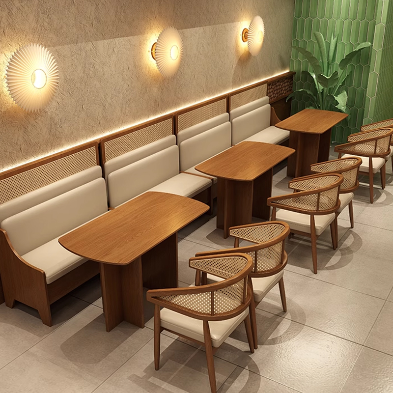 High Backrest Cream Cushions Restaurant Booth Restaurant seating area with rattan chairs and wooden tables, offering a comfortable and minimalist design