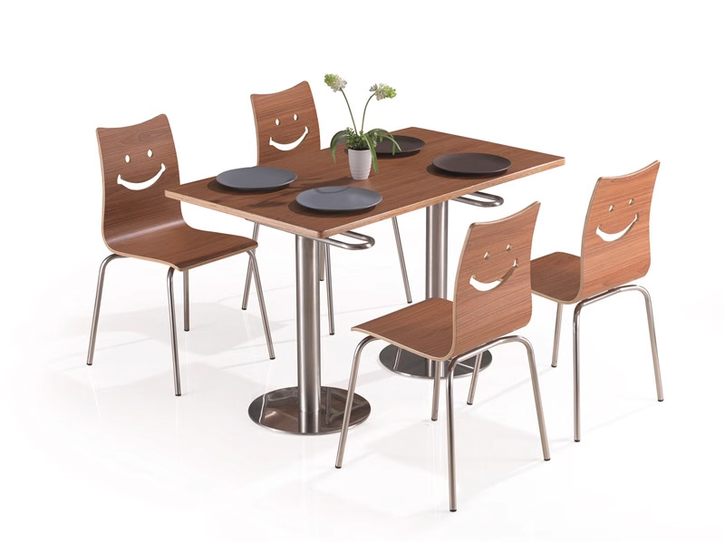 Smile Backrest Plywood Canteen Chair Set of four plywood canteen chairs with smile back design and chrome legs, paired with a square dining table featuring a matching wood finish and modern base