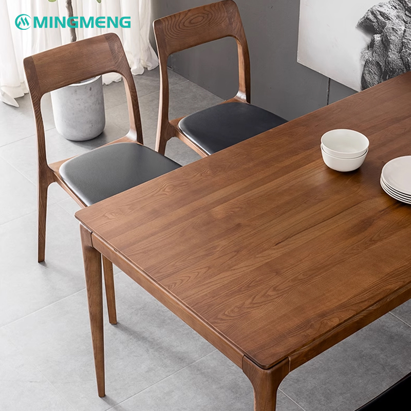 Creative stacked solid wood side table shown with a modern Scandinavian design and decorative plant