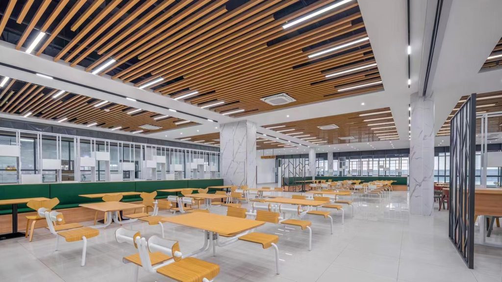 How to Choose the Best Cost-Effective Wooden Canteen Furniture in 20253 Modern canteen furnitures booth seating with comfortable cushions and light wooden tables, perfect for communal dining spaces.
