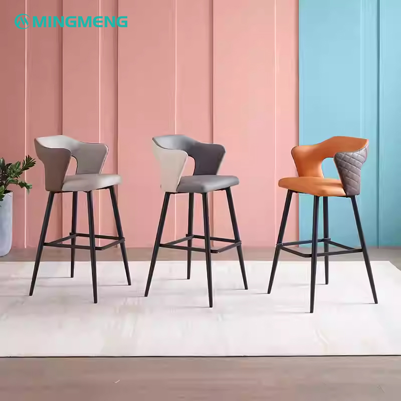 Three stylish bar stools with a combination of gray and orange seating, featuring black metal legs and a modern design. Perfect for contemporary kitchens, dining rooms, or commercial spaces.