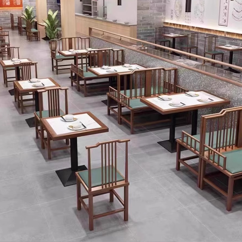 Traditional wooden tables with green cushioned chairs, perfect for a rustic, classic Chinese dining setup