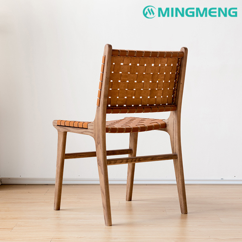 Back view of woven leather dining chair with ergonomic wooden structure