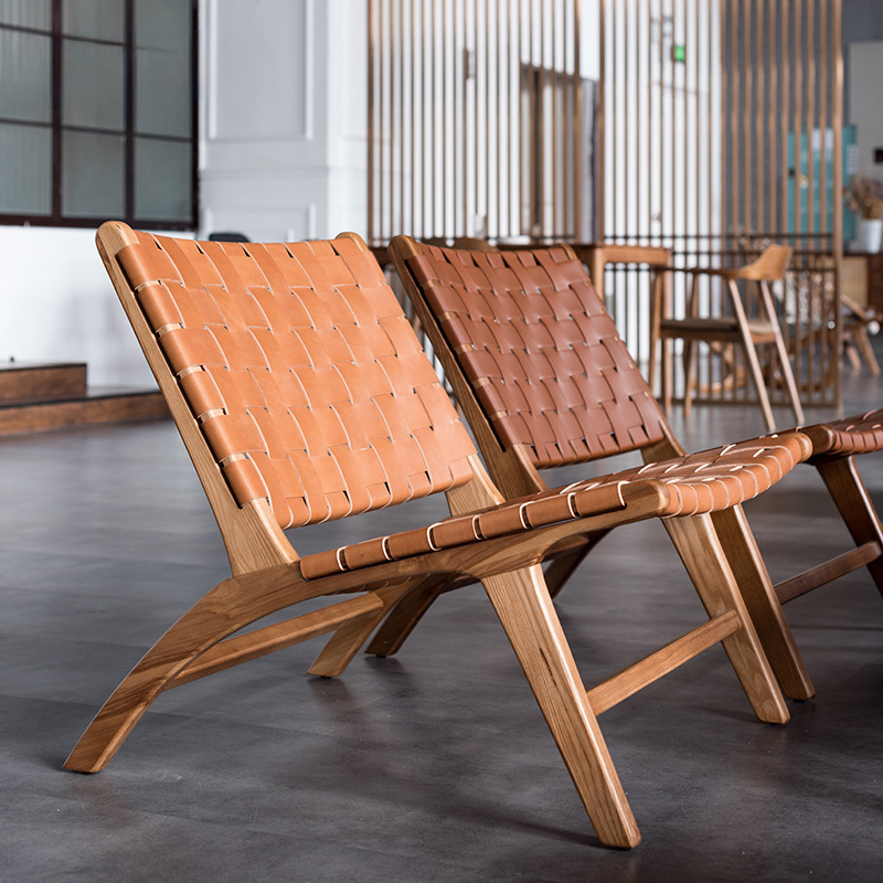 Mid-century modern woven leather lounge chair with walnut wood frame