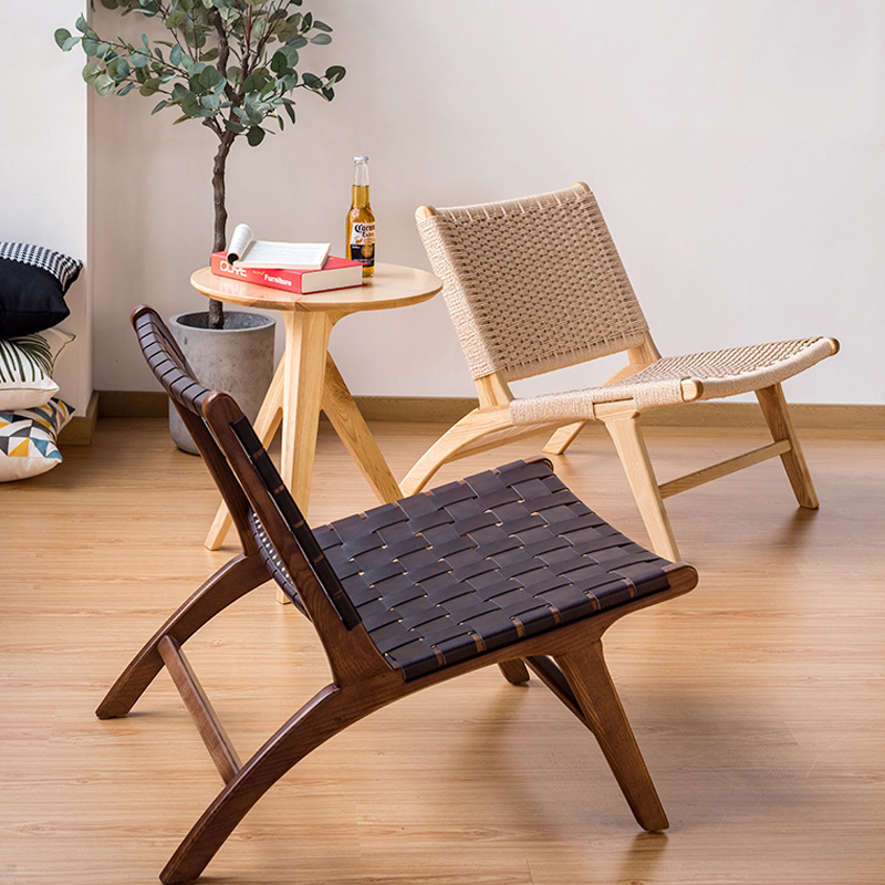 Scandinavian style lounge chairs featuring handwoven rope and dark brown leather designs