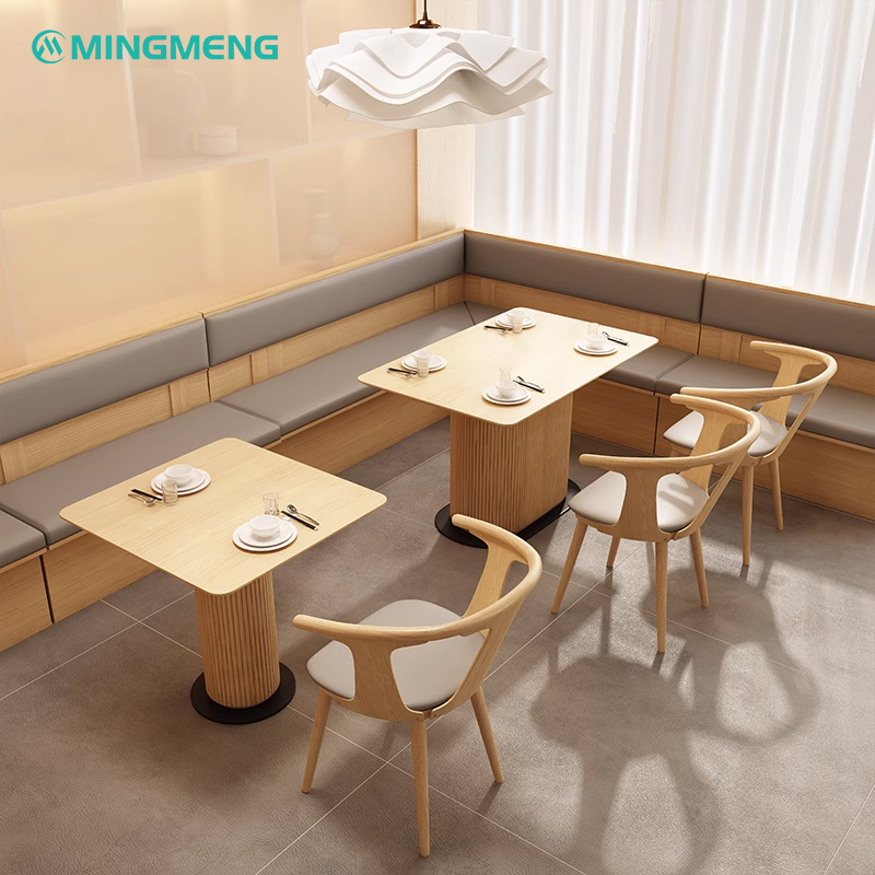 corner booth restaurant seating with light wood and grey leather cushions