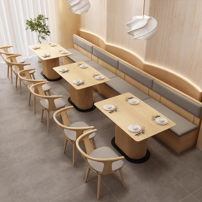 Grey Leather Cushion Minimalist Restaurant Wooden Booth Long light wood booth with wall-mounted design and grey leather cushions in a minimalist dining space