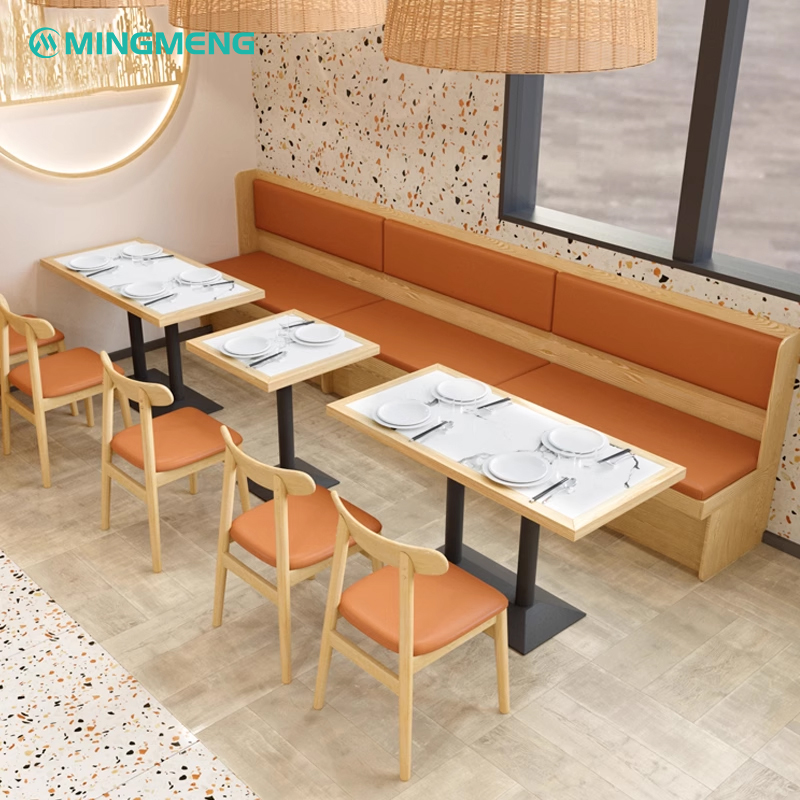 Long orange cushioned booth seating in a modern restaurant setting