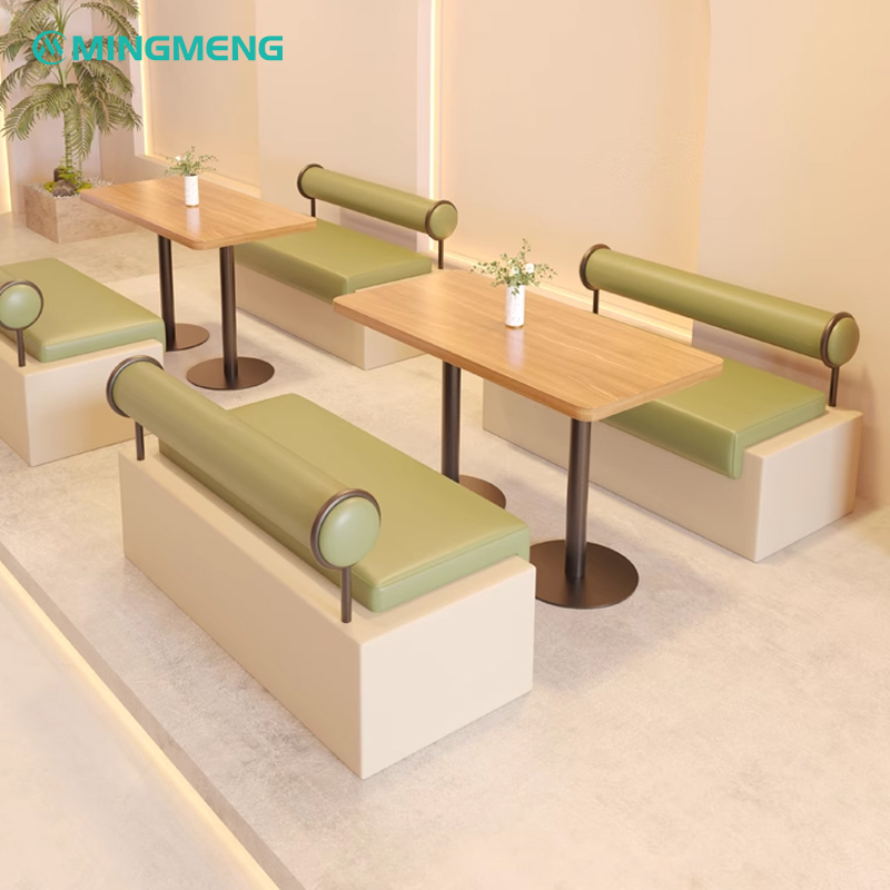 Elegant restaurant booth with green backrest and cushioned seat, perfect for modern restaurants