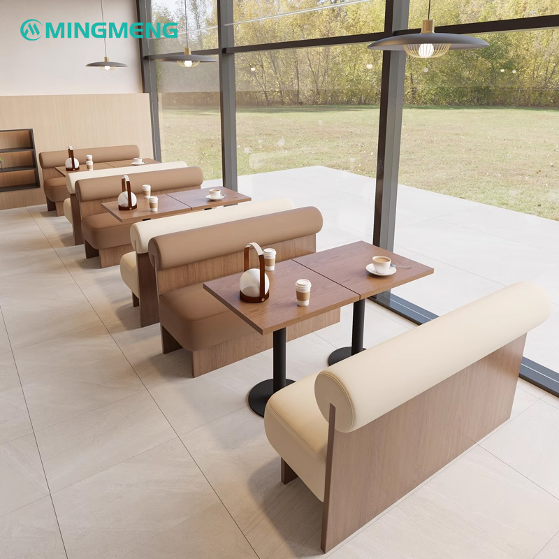 Minimalist restaurant booth seating with round tables and contemporary design, ideal for modern restaurants.