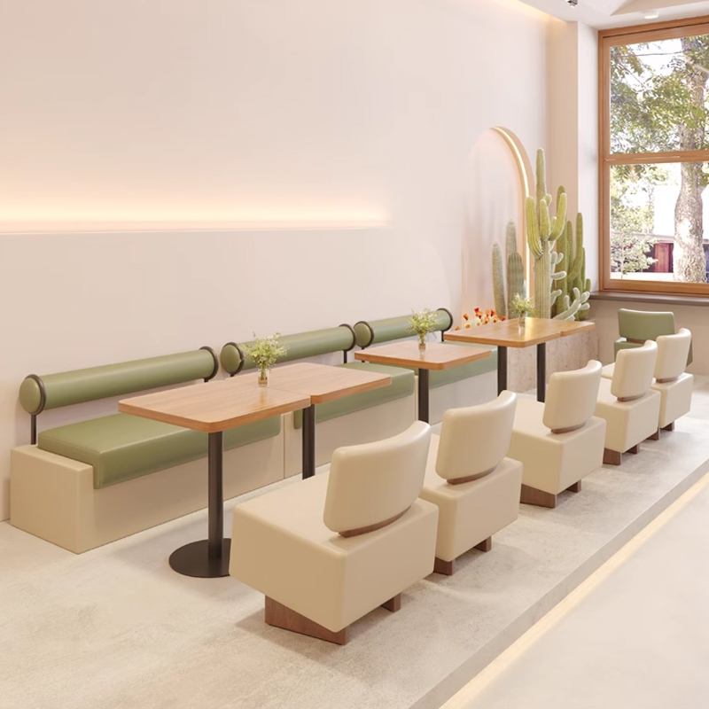 Green Dining Booth with Upholstered Seat&Round Backrest1 Modern restaurant booth with green cushions and wooden tables for a cozy dining experience