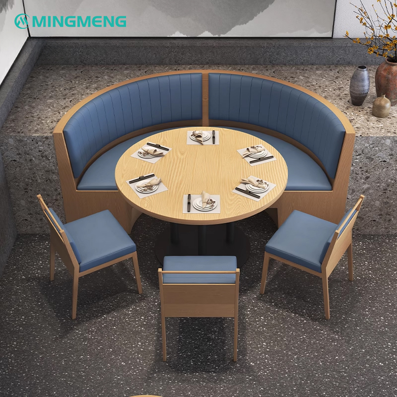 Classic Wood Veneer Restaurant Booth1 round wooden booth seat with blue leather cushion and matching round dining table in restaurant