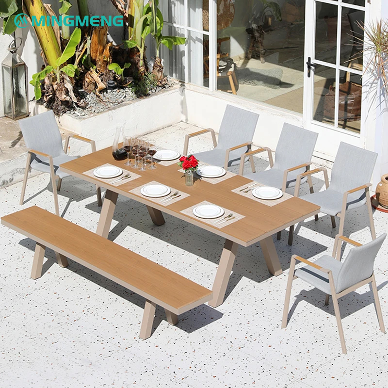 Modern Outdoor Textilene Dining Chair With Breathable Sling Seat large modern outdoor dining table with light grey fabric chairs and wood bench under dark umbrella