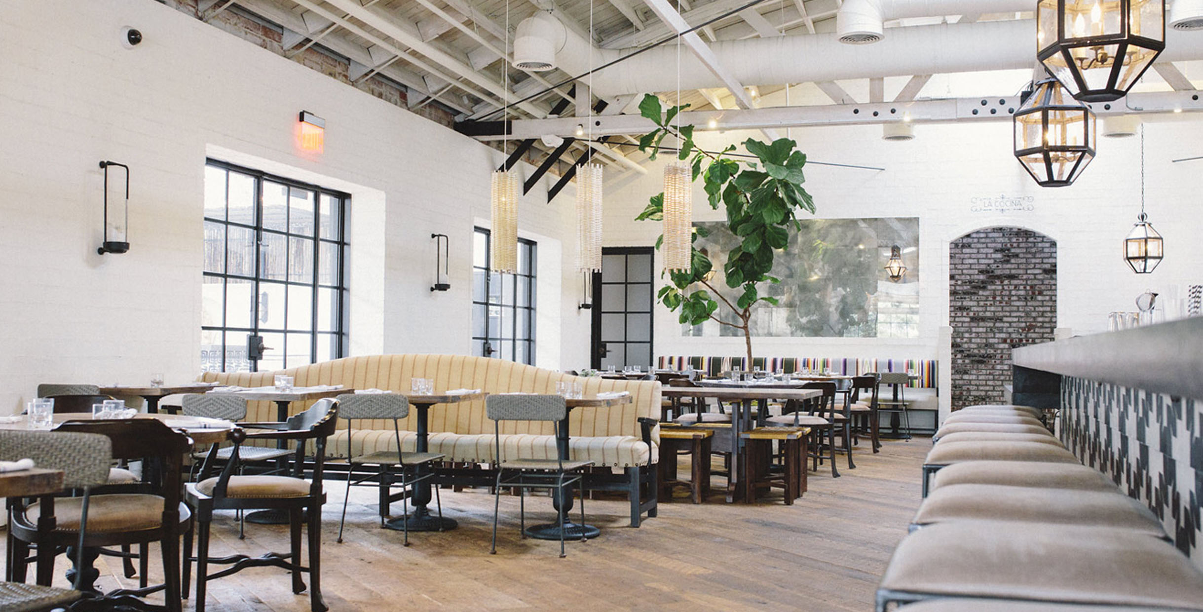 California style dining table and chairs in a cozy restaurant with a modern interior design