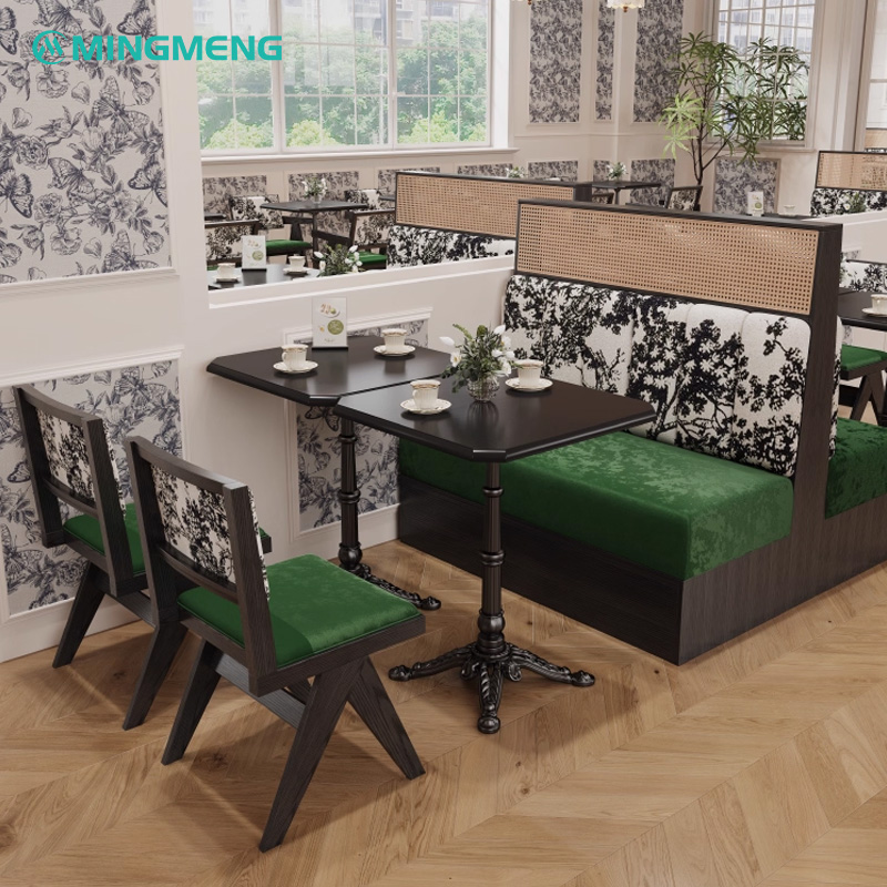 Artistic Restaurant Chair – Black Wood Frame with Green Velvet Seat & Patterned Backrest2 Restaurant interior featuring custom booth seating with green upholstered cushions, matching chairs, and black dining tables