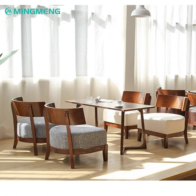 Nordic Solid Wood Lounge Chair2 Mingmeng restaurant furniture set featuring wooden dining chairs with upholstered cushions in gray and white, paired with a rectangular wooden dining table, ideal for modern restaurants and cafes