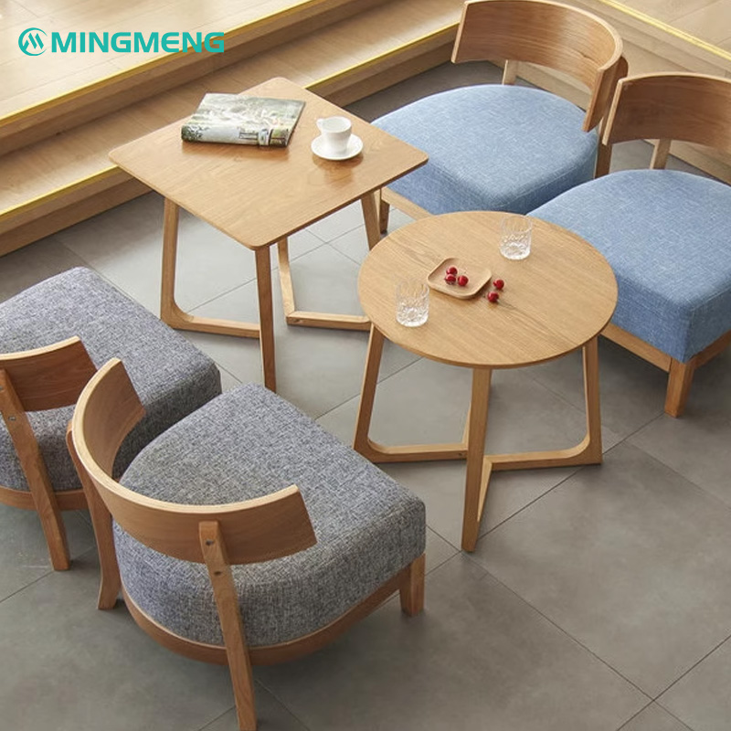 Nordic Solid Wood Lounge Chair3 Mingmeng restaurant furniture set featuring modern wooden chairs with upholstered cushions in blue and gray, paired with stylish wooden dining tables for cafes and restaurants