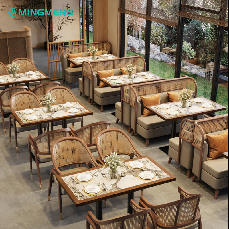 Custom Restaurant Booth – Dark Wood Frame with Beige Leather Seat & Rattan Backrest Contemporary restaurant booth seating with marble dining tables and cane back chairs in a bright dining space