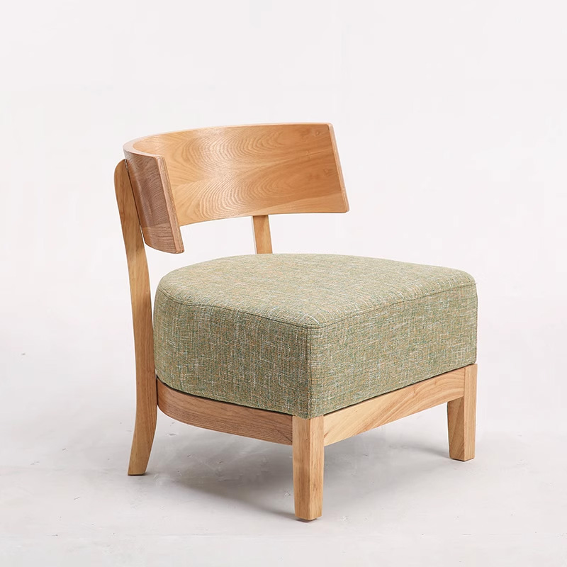 Nordic Solid Wood Lounge Chair1 Stylish restaurant chair featuring a solid wooden frame and green upholstered cushion, ideal for modern dining spaces and cafes