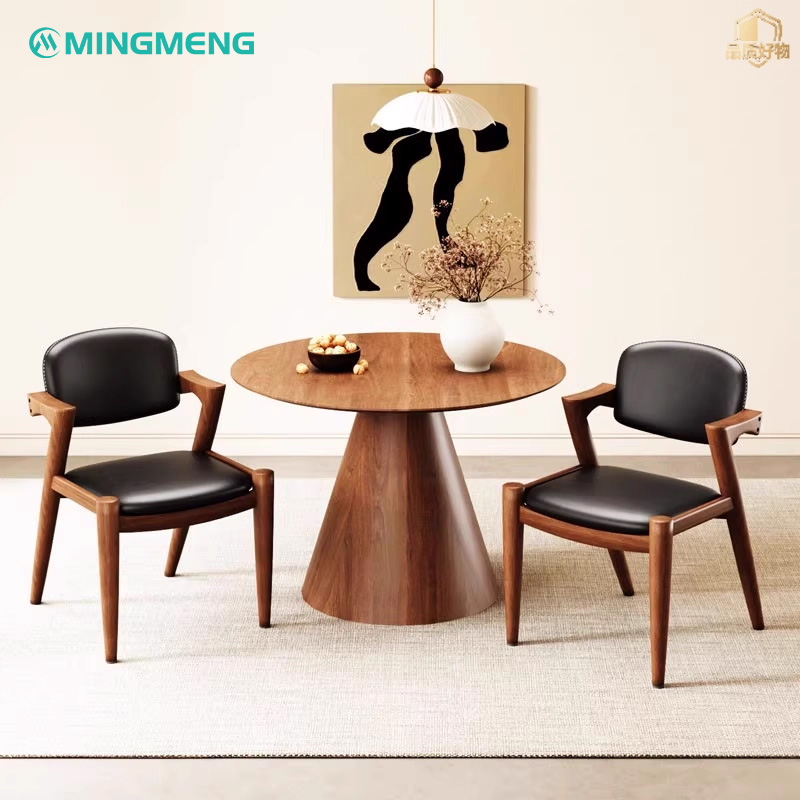 Nordic Modern Z-Shaped Dining Chair1 Pair of Nordic modern Z-shaped restaurant chairs with black leather seat and round wood dining table in contemporary interior