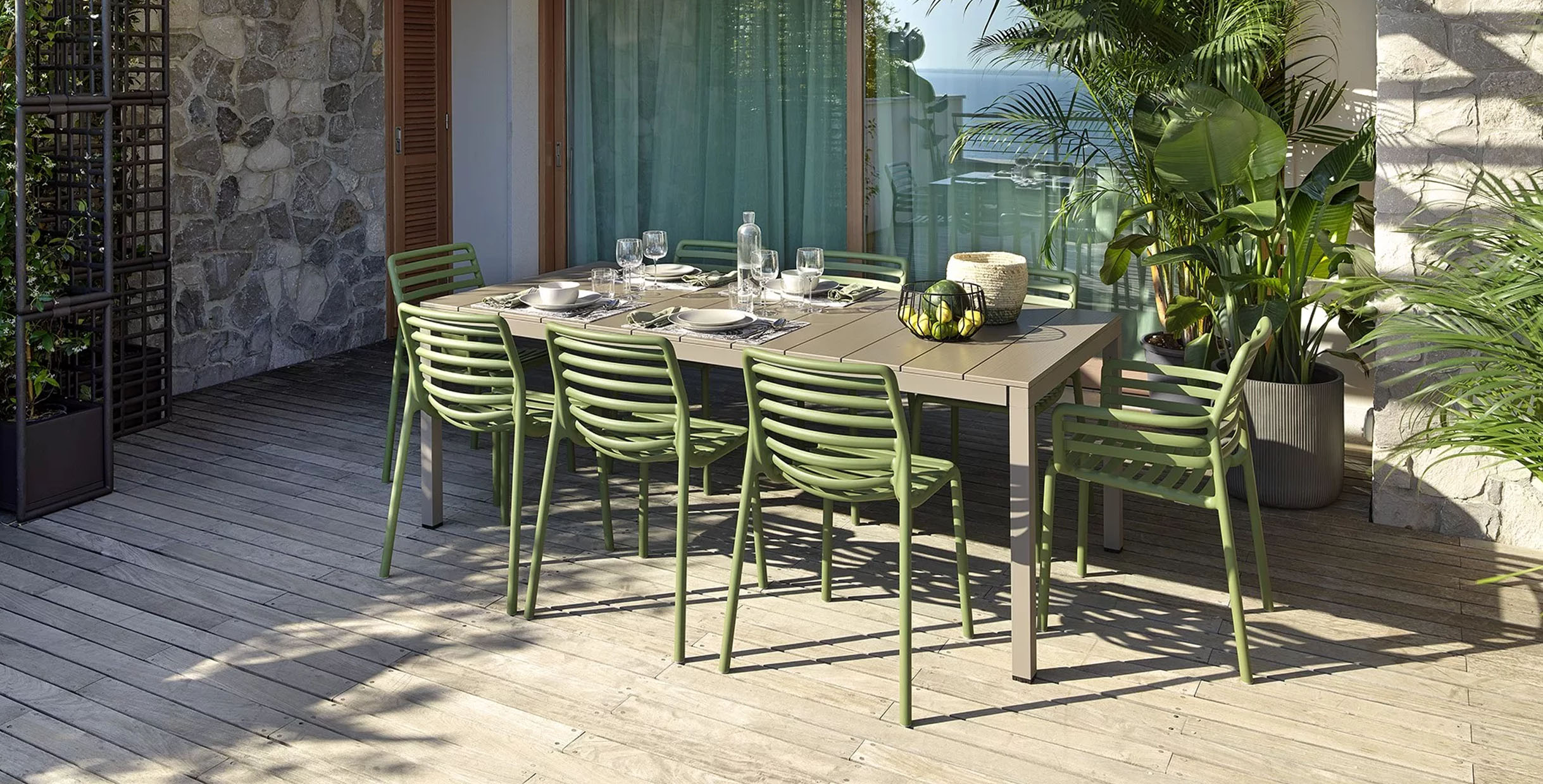 Stylish outdoor dining set with green chairs and a modern table, perfect for patios and gardens