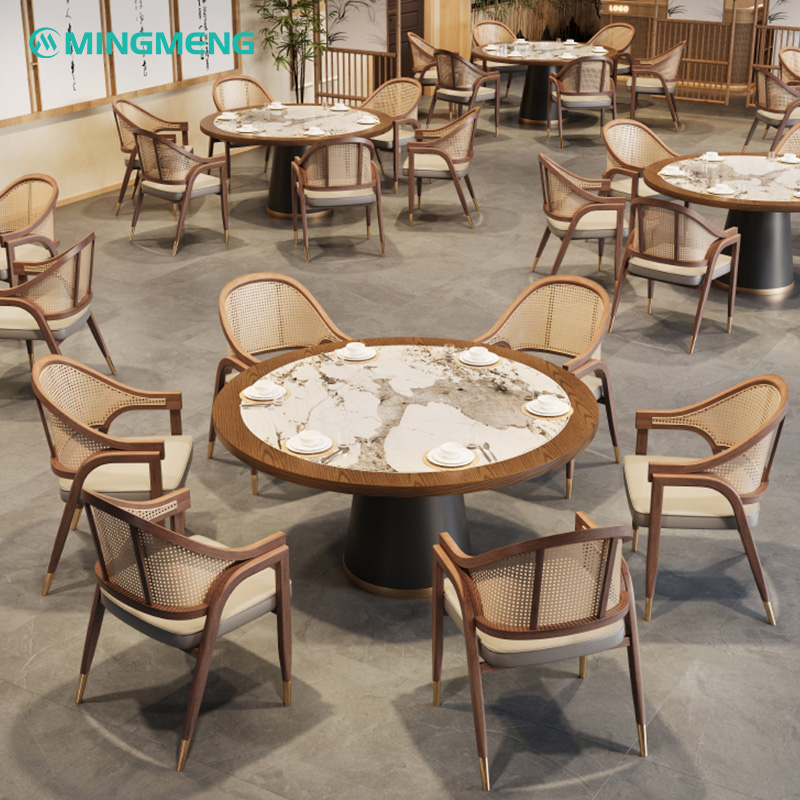 Custom Restaurant Booth – Dark Wood Frame with Beige Leather Seat & Rattan Backrest3 Elegant round marble dining table with cane back chairs in a modern restaurant interior