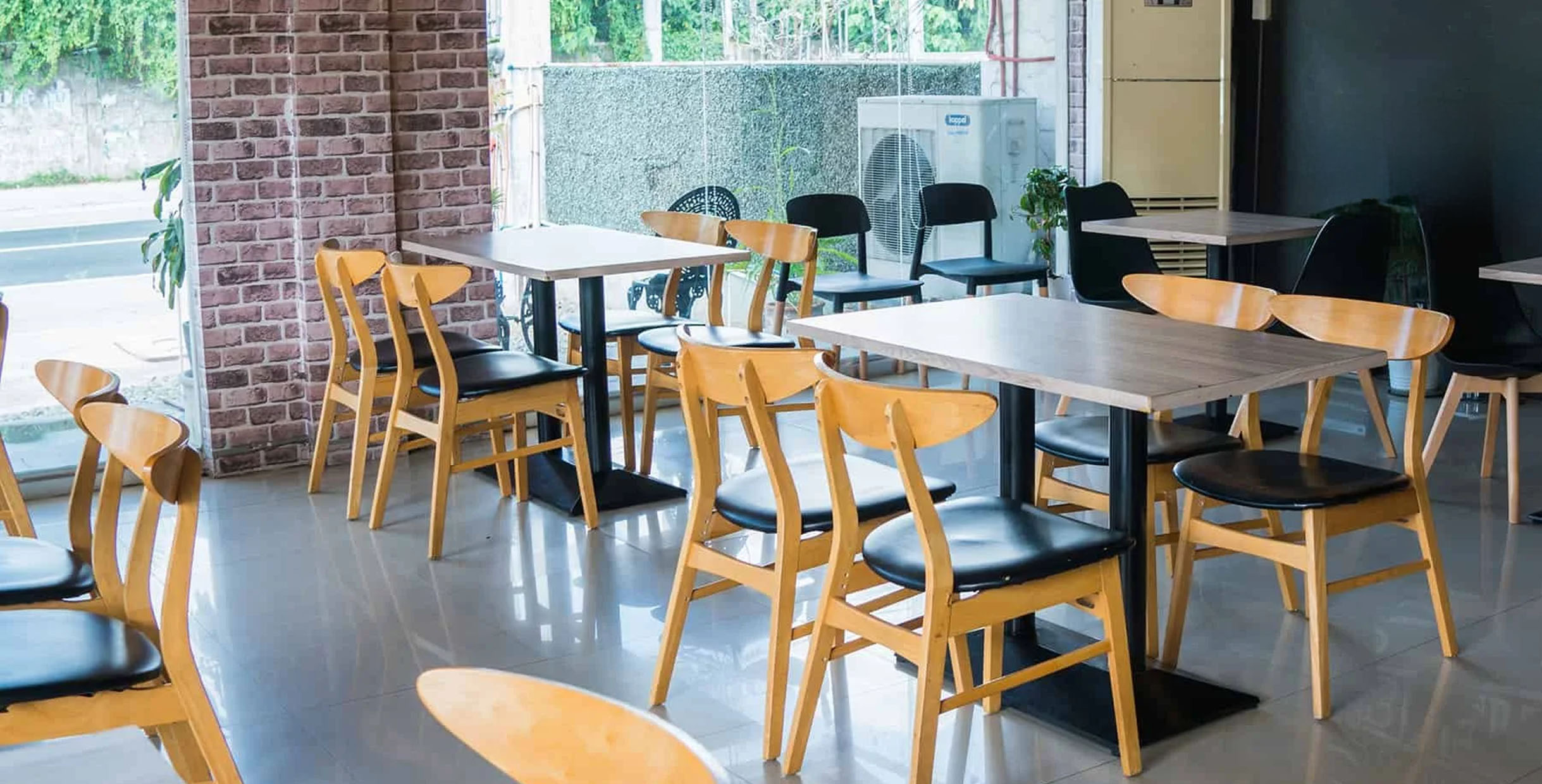 Wooden cafe set with tables and chairs designed for casual dining.
