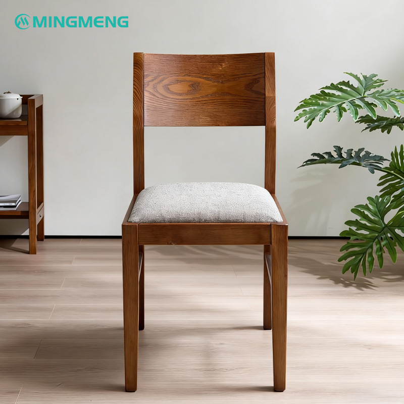 Dark Wood Frame with Grey Cotton-Linen Upholstered Restaurant Chair1 Modern wooden restaurant chair with natural finish and light beige fabric cushion seat placed in dining room